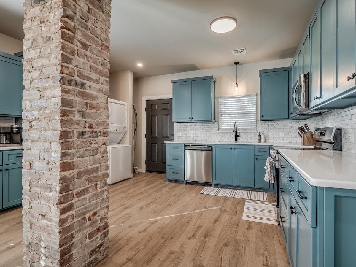 The fully-stocked kitchen comes with a toaster, Crock Pot, pizza pan and cutter, wine glasses, and everything else you need to feel right at home.

Plus, there is a TON of empty cabinet space to store all your food during your stay.